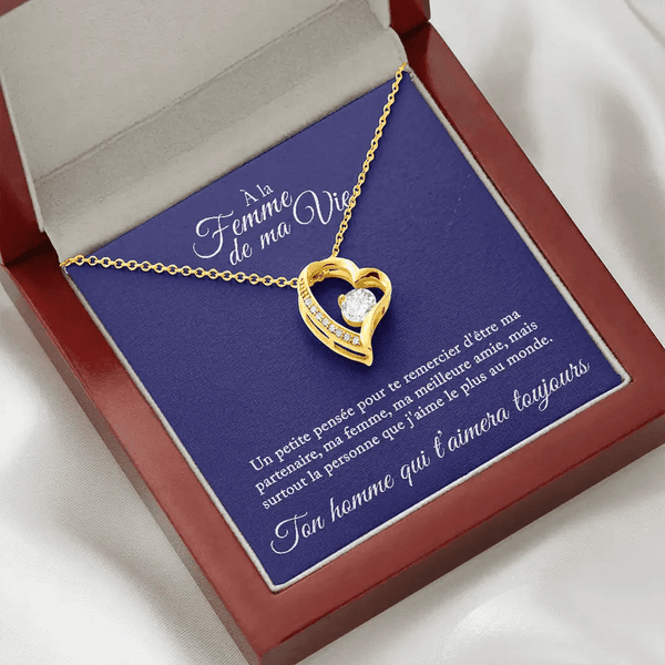 Le plus beau cadeau pour femme. Un collier en or avec une pensée sentimentale et un coffret en acajou